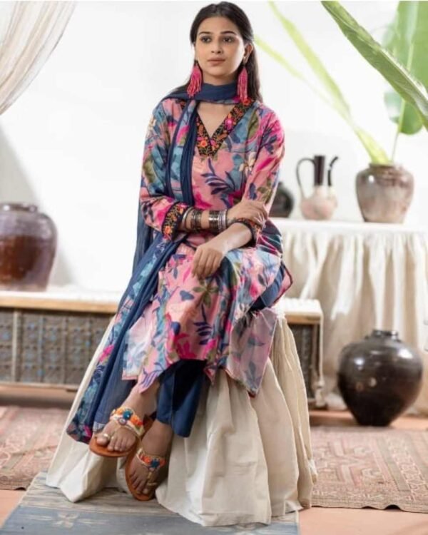 Mosel wearing a pink color stitched suit