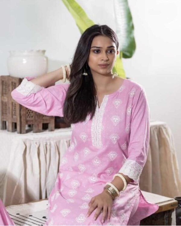 Woman sitting in a cotton stitched suit