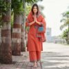 rust orange stitched suit