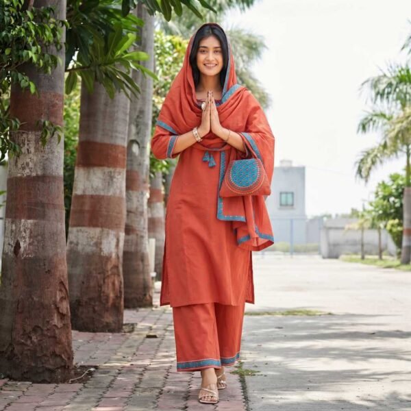 rust orange stitched suit